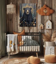 a baby's room decorated in neutral colors with bear artwork on the wall and stuffed animals