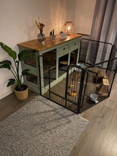 a room with a dog gate and rug on the floor