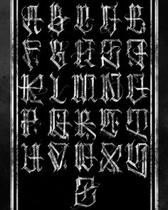 an old fashioned gothic alphabet in black and white with some type of writing on it