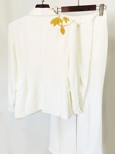 Material: Polyester, Cotton Embellished cady Featuring bead embroidery Long sleeves Flared pants Delicate dry clean Protect accessories before washing Cool iron Sample size: S Style № ZC_FOGELE Embellished Blazer & Flared Pants Set in White Elegant Embellished White Bottoms, Elegant White Pants With Floral Embroidery, White Elegant Embroidered Pants, Elegant Embroidered Bottoms For Formal Occasions, Elegant Floral Embroidered Pants For Wedding, Embellished White Bottoms For Wedding, White Embellished Wedding Bottoms, Elegant Embroidered Wedding Bottoms, Elegant Pants With Floral Embroidery For Weddings