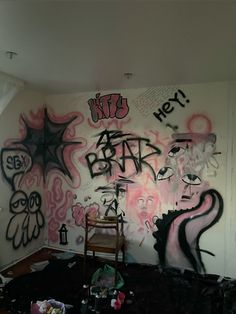 a room with graffiti all over the walls