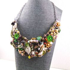 Mixed Media and Metals Design loaded with interest. Wearable Art piece. Maker Marked. Unique Multicolor Jeweled Necklaces, Unique Multicolor Decorative Necklaces, Multicolor Costume Jewelry Necklace For Collectors, Unique Jeweled Necklaces, Sea Nymph, My Community, Snail Shell, Maker’s Mark, White Agate