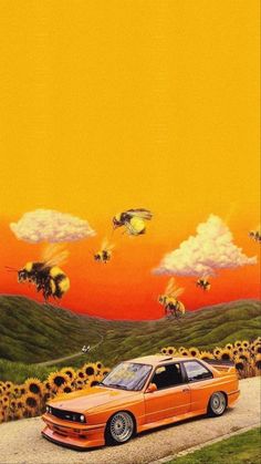 an orange car parked in front of a field of sunflowers with bees flying over it