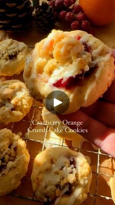 a person is holding up some cranberry orange cookies