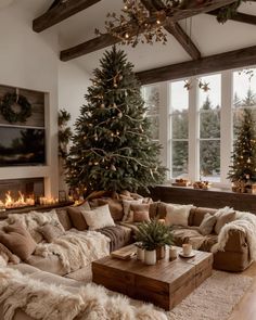 a living room filled with furniture and christmas trees