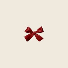 a red bow on a white background