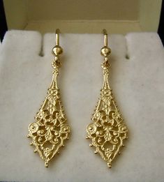 100% AUSTRALIAN MADE BRAND NEW GENUINE SOLID 9ct YELLOW GOLD  VINTAGE STYLE FILIGREE DANGLE EARRINGS Stunning, Beautifully Crafted with PRECISION and DETAIL  GENUINE SOLID GOLD   NOT FILLED   NOT PLATED  NOT HOLLOW HALLMARKED (Stamped) 9ct   Earring Width : 10 mm (widest point) Earring Length : 28 mm (not including hook)  34 mm (including hook) Earrings Weight : 2.4 grams approx. Our QUALITY is GUARANTEED. Buy with confidence. If you are not satisfied for any reason you can return it for a full Luxury Yellow Gold Jewelry For Vintage Events, Luxury Elegant Gold Plated Danglers, Luxury Festive Yellow Gold Danglers, Luxury Traditional Yellow Gold Danglers, Luxury Yellow Gold Danglers For Diwali, Gold Earrings Vintage, Faberge Jewelry, Pretty Accessories, Gold Jewellry