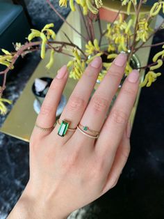 This wonderfully delicate Emerald infinity band is set in 18K yellow gold. These emeralds are perfectly suited for stacking.  Each hand-selected gemstone has been meticulously bezel set by our master goldsmith.  These gorgeous emeralds have been ethically sourced from the world's first class gemstone company Gemfields. Classic Green Emerald Cut Stackable Rings, Classic Green Emerald-cut Stackable Rings, Elegant Green Emerald Cut Stackable Rings, Fine Jewelry Green Emerald Cut Stackable Rings, Fine Jewelry Green Emerald Stackable Rings, Fine Jewelry Green Emerald-cut Stackable Rings, Green Emerald Stackable Rings In Fine Jewelry Style, Emerald Cut Green Stackable Rings Fine Jewelry, Green Emerald Cut Stackable Rings