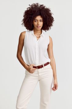 Our warm weather staple.The Signature Sleeveless Shirt is a classic for layering or to wear on its own. Narrow armholes mean bra won't peek through the side (and won't peek through the front either.) This fabric has a crepe-like pebbly texture and resists wrinkling. 

 Rochelle Behrens reimagined how shirts should fit and feel. Our patented No Gape® button technology, seamlessly designed into every shirt and shirtdress we design, eliminates blouse gape. Finally say bye bye blouse gape, hello The Shirt.

  
 * Poly Crepe
  
 * Made in Portugal 
 * Powered by our patented No Gape® button technology 
 *  Model is 5'9" wearing size S Say Bye, Summer Favorites, Women Artisans, Light Blue Color, Hello Summer, The Shirt, Shirtdress, Bye Bye, Sleeveless Shirt