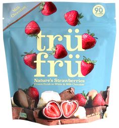 a bag of truf fru with strawberries and chocolates on it's side