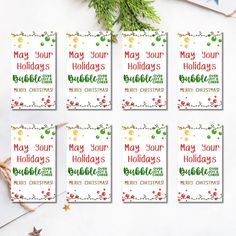 six holiday cards with the words may your holidays be merry on them, surrounded by christmas decorations