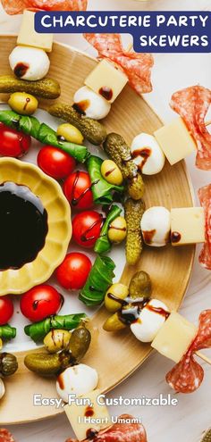 a plate with different types of food on it and the title, charcuterie party skewers easy - fun customizables