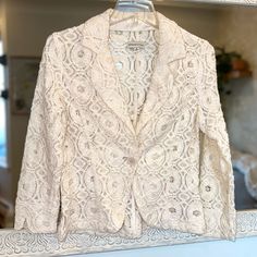 Adrienne Vittadini Lace Blazer Excellent Condition Single Front Button Ivory Color Fabric Has No Stretch Size M Armpit To Armpit: ~19” Length: ~21.5” If You Are Brand New To Poshmark, Use Code Cem_poshmark At Checkout For $10 Off Your First Order. Spring Wedding Blazer With Button Closure, Vintage White Long Sleeve Blazer, Fitted Cream Feminine Outerwear, Elegant White Button-up Blazer, Cream Blazer For Fall Wedding, Cream Wedding Blazer For Fall, Feminine Cream Outerwear For Formal Occasions, Elegant Off White Outerwear For Spring, Feminine Formal Cream Outerwear