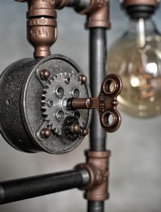 the pipes are connected to different types of valves and fittings, with one light bulb in the background