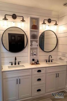 A farmhouse bathroom featuring dual sinks, round mirrors, shiplap walls, black fixtures, and ample storage, creating a cozy and functional space. Farmhouse Fixtures Bathroom, Modern Farmhouse Master Bath Mirrors, Shiplap Farmhouse Bathroom, Farmhouse Bathroom Sink Ideas, Modern Farm Bathroom, Ideas Under Staircase, Shiplap Wall Bathroom, Shiplap Bathroom Ideas, Under Stairs Bathroom