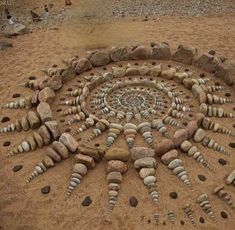 a circle made out of rocks in the sand