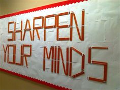 a sign that says sharpen your mind 5 on the side of a wall in an office