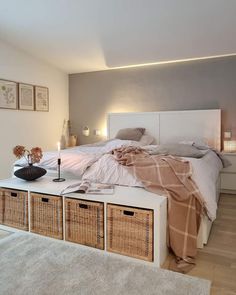 a bedroom with a bed and baskets on the floor