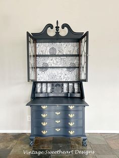 an old china cabinet painted blue and gold