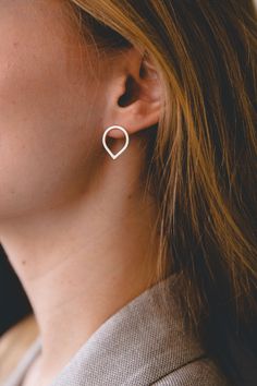 "This beautiful and minimal open teardrop stud earrings are handmade of 925 sterling silver square wire and has been brushed to a matte finish for a finer look. Those simple raindrop earrings are small, elegant and perfect for everyday wear! Measurements: ● Length: 1.5 cm / 0.4\" Width: 1.3 cm / 0.4\" Want to see more jewelry from my shop? click here: http://etsy.me/2uPuv0x Find more earrings here: http://etsy.me/2tW4sYr Find matching rings here: http://etsy.me/2u40p9h ● Item will be shipped bea Minimalist Sterling Silver Drop Wrap Earrings, Sterling Silver Minimalist Drop Wrap Earrings, Minimalist Teardrop Pierced Jewelry, Minimalist Nickel Free Teardrop Wrap Earrings, Minimalist Jewelry With Matching Teardrop Pendant Earrings, Minimalist Nickel-free Teardrop Wrap Earrings, Minimalist Teardrop Nickel-free Wrap Earrings, Modern Teardrop Wrap Earring (single), Modern Teardrop Earrings For Gift