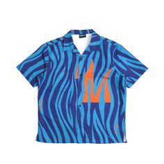 Red Multicolor Zebra Print/ Light Blue M Short Sleeve camp shirt with slight crop. The shirt features our signature Zebra M Pattern in an assortment of colors and a Orange M. The shirt is true to size, please size up for an oversized wider fit. True To Size No Refunds Or Exchanges Blue Camp Shirt For Summer Streetwear, Blue Camp Shirt With Graphic Print, Relaxed Fit, Blue Short Sleeve Camp Shirt For Streetwear, Trendy Short Sleeve Camp Shirt For Streetwear, Casual Camp Collar Tops For Streetwear, Spring Streetwear Tops With Camp Collar, Blue Collared Shirt For Streetwear, Spring Streetwear Camp Shirt With Camp Collar, Camp Shirt