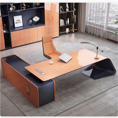 an office desk with a laptop on it in front of a bookcase and shelves