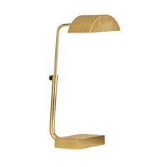 a gold desk lamp on a white background with the light turned off to show its dim lighting