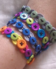 the bracelets have buttons on them and are multicolored