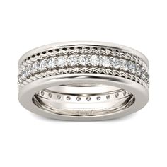 Surprise the man you love with this impressive band. Crafted in sterling silver, this dazzling style shimmers with a row of round stones that completely surround the band. The rope design decorate the top and bottom of this design. Simple and striking, this handsome wedding band is a shining symbol of your marriage commitment. Carat Weight: 1.645 ctStone Size: 1.8 mmStone Type: Jeulia® StoneNumber of Stones: 35 Stone Color: Diamond WhiteStone Shape: RoundWeight: 7 gWidth: 7.2 mmThickness: 2.8 mmMaterial: 925 SilverPlating Color: Silver Classic Silver Bands With Vvs Clarity, Classic Silver Band With Vvs Clarity, Classic Silver Diamond Band, Classic Silver Eternity Band With Diamond Cut, Classic Silver Eternity Band With Diamond Accents, Classic Silver Bands With Diamond Cut, Elegant Silver Bands With Channel Set, Elegant Silver Channel Set Bands, Men's Wedding Bands