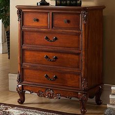 a wooden chest of drawers in a living room