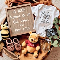 winnie the pooh baby shower gift basket with personalized onesie and other items