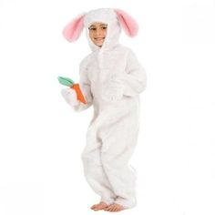 a child in a bunny costume holding a carrot