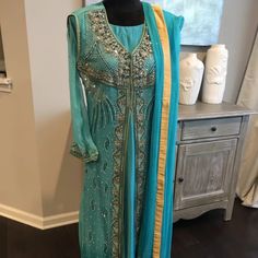 Hi, I Am Selling A New Pakistani Blue Handmade Silk Maxi Dress 4-Piece Suit For Womens In Size 8/10 Any Questions Please Ask. All Items Come From A Pet-Free And Smoke-Free Home. Measurements: Shoulder: 15 Inchesbust: 19 Inches Waist: 19 Inches Pants: Waist: 32 Length: 41 Inches Shirt Can Be Altered, There Is Fabric Inside Blue Evening Dress With Dupatta, Blue Formal Gown With Dupatta, Formal Blue Gown With Dupatta, Elegant Turquoise Set With Dupatta, Blue Embellished Party Set, Blue Anarkali Gown For Formal Occasions, Blue Floor-length Dress For Reception, Floor-length Blue Dress For Reception, Blue Embellished Formal Sets