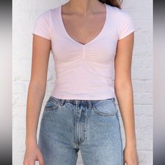 Soft And Stretchy Fitted Tee With A V-Neck Collar, Rouched Detailing, And A Seam Under The Bust. Fabrics: 98% Cotton, 4% Elastane Measurements: 17" (43 Cm) Length, 14" (56 Cm) Bust Made In: Italy Feminine Short Sleeve V-neck Top, Trendy Fitted V-neck Top With Short Sleeves, Casual V-neck Fitted Top, Fitted Tops With Notched Neckline For Spring, Trendy Stretch Low-cut Tops, Fitted Cotton V-neck Top For Spring, Fitted V-neck Top For Spring, Trendy Fitted Low-cut Top, Fitted Casual Low-cut Top