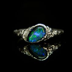 Gold - delivery in January 2024. Unique organic ring with fine quality Black Opal triplet. Intricate ornaments make this ring a One-of-a-kind alternative to traditional engagement rings. Made from solid silver/gold (choose from the dropdown menu). Finish: polished to shine. Band thickness: 1.2 mm rear / 8 mm front. Gemstone: 8x5 mm Black opal triplet (fine quality). Technique: fire-texturing and forming. Custom-made according to your preferences on size and metal. This item comes with a UK hallmark (gold). Please allow the processing time for preparing and hallmarking your ring. Jewellery is delivered wrapped in a branded eco-friendly gift box. For larger sizes please contact us for details. Packaging: All boxes bear an FSC Certificate (more details on eco-credentials: www.fsc.org). This m Black Opal Wedding Ring, Engagement Rings Beautiful, Black Opal Jewelry, Rings Beautiful, Black Opal Stone, Black Opal Ring, Traditional Engagement Rings, Opal Wedding Rings, Ethiopian Opal Ring