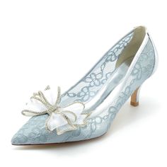 a pair of women's shoes with bows on them