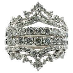 a stack of silver rings with white diamonds on each one and two rows of different sizes