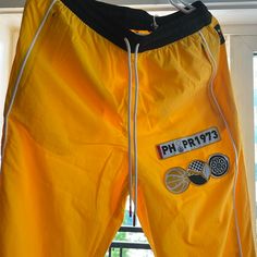 Puma Porsche Men’s Basketball Woven Pants , Yellow, Size Medium, With Drawstring, Brand New With Tag Sporty Yellow Cotton Bottoms, Yellow Sporty Bottoms For Outdoor, Yellow Streetwear Pants With Pockets, Sporty Yellow Bottoms For Outdoor, Yellow Pants With Pockets For Streetwear, Streetwear Yellow Pants With Elastic Waistband, Sporty Yellow Gym Bottoms, Yellow Cotton Sports Pants, Yellow Pants With Elastic Waistband For Streetwear