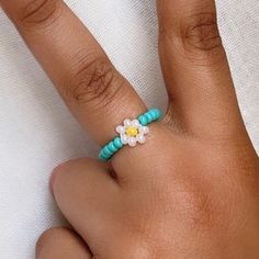 Daisy flower Ring Choose from S / M / L Choose your flower color and your center color too! You will receive (1) one ring ✨About Me✨ Hi! My name is Jordi, I'm 13 years old and I've been creating beaded jewelry for a year now. Thank you for stopping by and checking out my jewelry.  ✨Shipping✨ I will ship your order within 3-5 days, I try to get them out as soon as possible :).  ✨Shop Policies✨  All sales are final, every order is made to order and fit the buyer. Thank you for taking the time to c Adjustable Flower Ring For Summer, Trendy Adjustable Flower Ring, Bohemian Flower Ring For Spring, Adjustable Multicolor Flower Ring With Colorful Beads, Adjustable Multicolor Flower Ring With Beads, Multicolor Adjustable Flower Ring, Ring Y2k, Colorful Rings, Jewelry Colorful