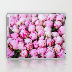 a bunch of pink flowers sitting on top of a laptop computer skins and skins