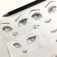 pencil drawings of eyes and eyebrows on top of a sheet of paper with the eyeliners drawn