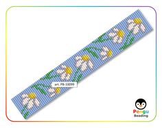 a cross stitch bracelet with white flowers on blue and yellow ribbon, in the shape of a