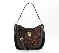 Fierce and elegant, this gorgeous crossbody bag is all about the details. The faux-leopard haircalf is eye-catching, as is the leopard head hardware. Multiple carrying options make it a must-have for any fabulously fashionable woman. From Patricia Nash. Evening Shoulder Bag In Leopard Print With Detachable Strap, Leopard Print Shoulder Bag With Detachable Strap For Evening, Evening Leopard Print Shoulder Bag With Detachable Strap, Luxury Leather Shoulder Bag In Leopard Print, Luxury Leather Leopard Print Shoulder Bag, Elegant Leopard Print Shoulder Bag With Detachable Handle, Leopard Print Satchel Shoulder Bag With Gold-tone Hardware, Leopard Print Leather Bag With Gold-tone Hardware, Luxury Leopard Print Shoulder Bag With Gold-tone Hardware