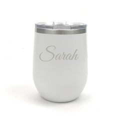 a white wine tumbler with the name sarabi on it and a silver lid