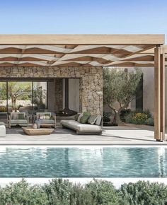 an outdoor living area next to a pool