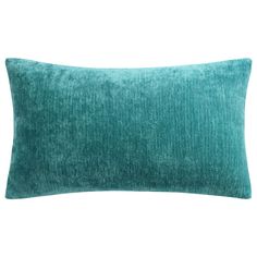 a teal green pillow on a white background