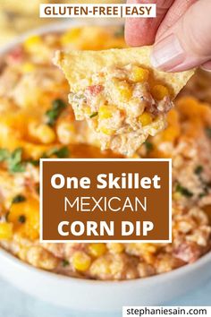 a hand holding a tortilla chip over a bowl of corn dip with the text gluten - free easy mexican corn dip