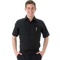 a man standing with his hands on his hips wearing black pants and a short sleeved shirt