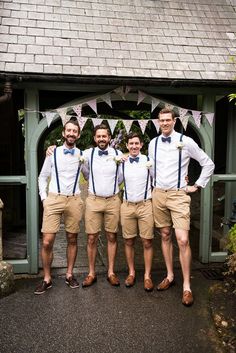 four men in tan shorts and bow ties posing for the camera