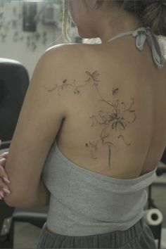 a woman with a tattoo on her back